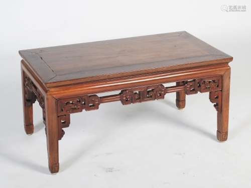 A Chinese dark wood Kang table, late 19th/early 20th century, the rectangular panelled top above a