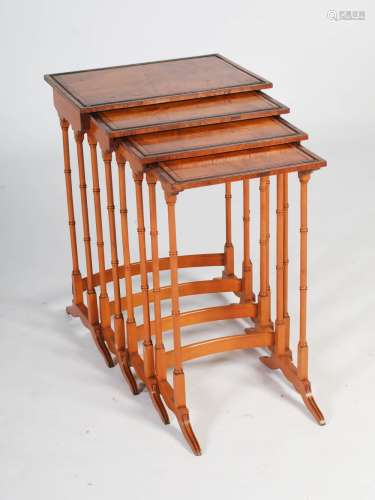 A quartetto of Regency style satinwood, rosewood and ebony lined occasional tables, of rectangular