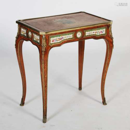 A late 19th century French kingwood, porcelain and ormolu mounted ladies writing table, the