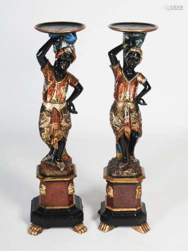A pair of late 19th century Venetian carved and painted wood ornamental figurative stands, each