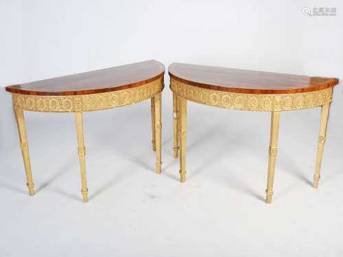 A pair of 19th century mahogany, satinwood and gilt wood console tables in the Neo Classical
