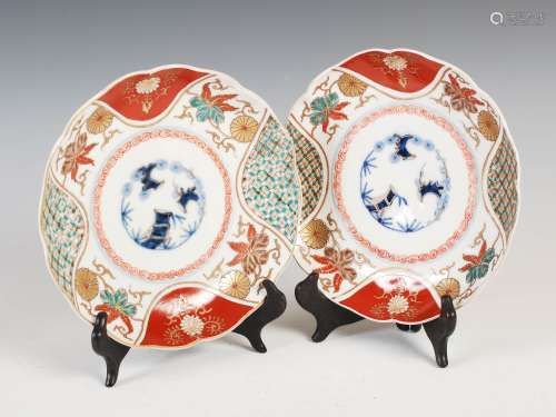 A pair of Japanese Imari plates, Meiji Period, decorated with central roundel of bamboo and pine,