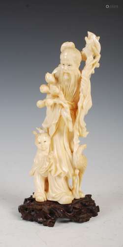 A Japanese ivory okimono of scholar, egret and boy, Meiji Period, signed on carved wood stand, 21.