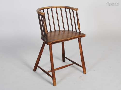 A 19th century country made ash and beech wood comb back chair, the horseshoe shaped top rail