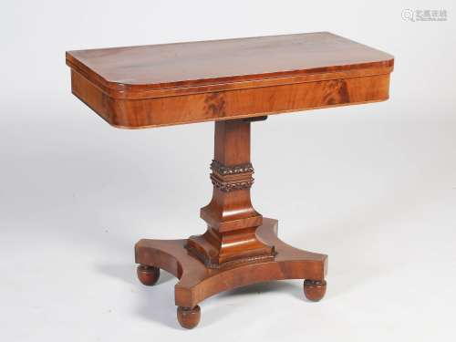 A 19th century mahogany pedestal tea table, the hinged rectangular top above a plain frieze,