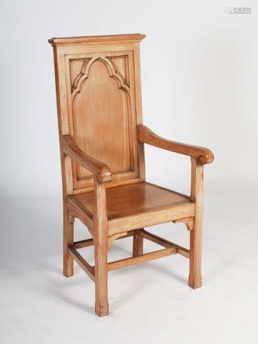 An early 20th century oak presentation altar armchair, the rectangular panelled back with Gothic