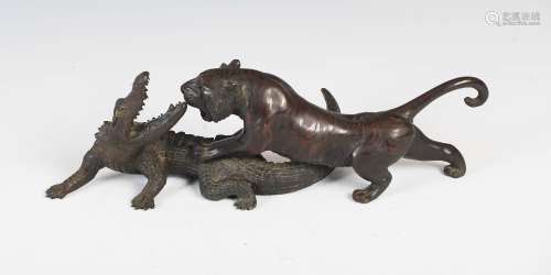 A Japanese bronze figure group of tiger and crocodile, Meiji Period, signed, 38cm wide x 11.5cm