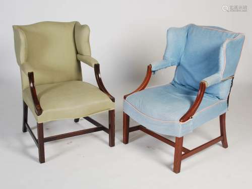 A pair of George III style mahogany Gainsborough wing armchairs, the upholstered backs, arms and