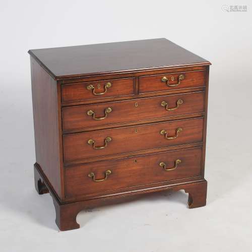 A George III style mahogany dwarf chest, the rectangular top with moulded edge above two short and