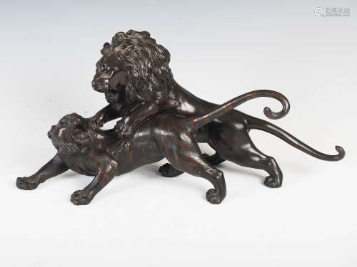 A Japanese bronze figure group of lion and tiger, Meiji Period, signed, 44cm wide x 21cm high.