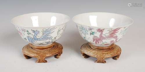 A pair of Chinese porcelain footed bowls, four character Qianlong mark but later, decorated with