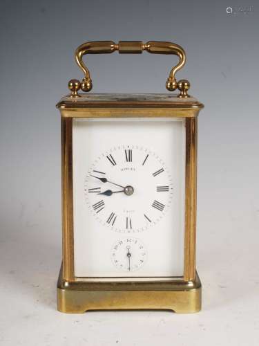 A late 19th century brass carriage clock, Hawley, Paris, the white enamelled dial with Roman