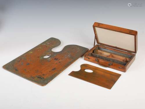 A 19th century walnut artists 'en plein air' paint box and oak palette, the artists box opening to a