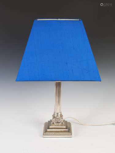 A late 19th/early 20th century electroplated Corinthian column table lamp and shade, the