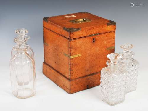 A 19th century oak and brass bound decanter box, the hinged cover with recessed military type handle