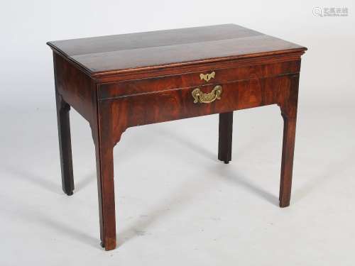 A George III mahogany architects desk/table, the hinged rectangular top with moulded edge and centre
