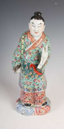 A Chinese porcelain famille rose figure of a scholar, late 19th/early 20th century, 34cm high.