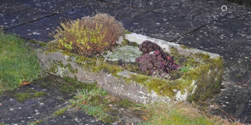 A 19th century carved stone garden planter.