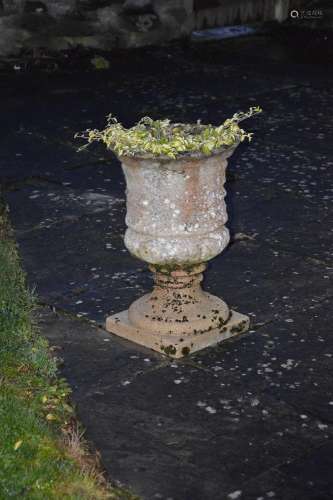 A composite stone urn, formed in two sections, 59cm high.