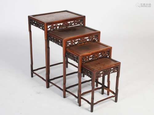 A quartetto of four Chinese dark wood occasional tables, late 19th/early 20th century, the