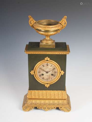 A 19th century gilt metal Regency style mantel clock, the circular engine turned dial with Roman