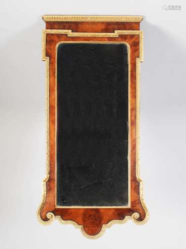 A 19th century George II style walnut and parcel gilt wall mirror, the moulded cornice with egg