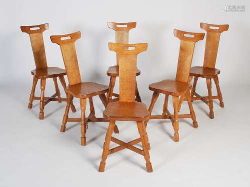 Beaverman - A set of six oak dining chairs, the rectangular top rails with pierced cut out above a