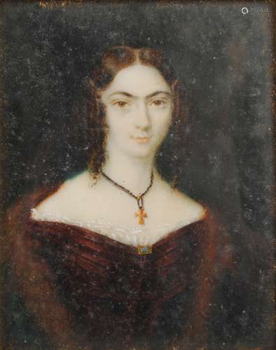 A 19th century portrait miniature of a young lady, probably painted on ivory, the reverse paper