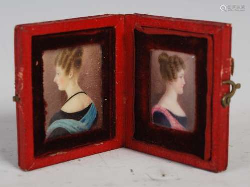 A 19th century leather cased double portrait miniature, opening to reveal two sisters, one with blue