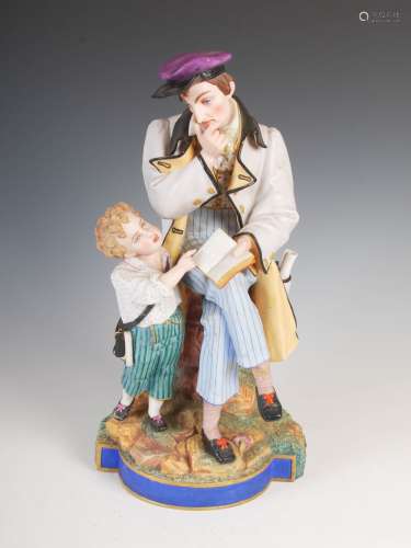A late 19th century French Bisque porcelain figure group of teacher and boy, naturalistically