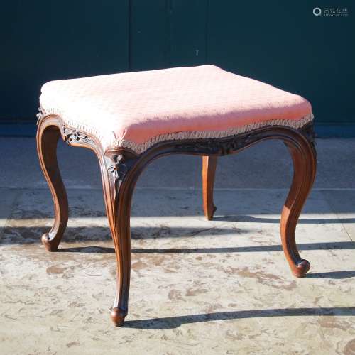 A Victorian mahogany stool, the shaped rectangular top with serpentine edge, raised on four