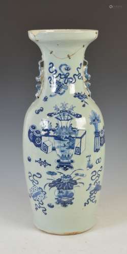 A Chinese porcelain blue and white vase, Qing Dynasty, decorated with vases issuing flowers and