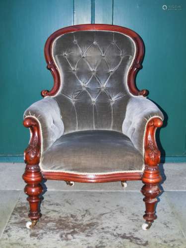 A Victorian mahogany parlour chair, the grey velvet upholstered button down back, arms and seat