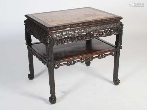 A Chinese dark wood centre table, Qing Dynasty, the rectangular top with mottled red and white