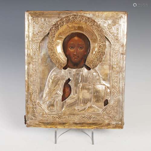 A Russian icon of St. Nicholas, Tempera on pine panel with pierced and embossed silvered yellow