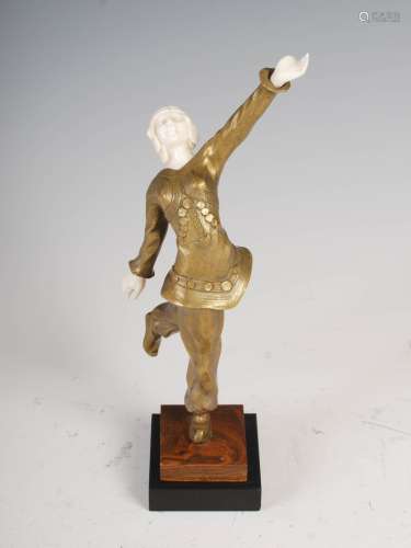 An early 20th century Art Deco bronze and ivory figure group of a ballets russe dancer, modelled