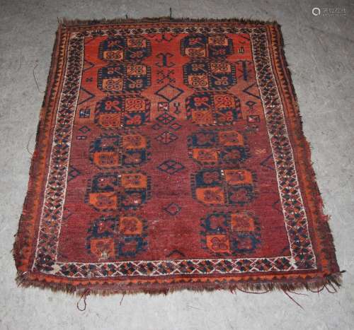 Three Persian rugs, late 19th/early 20th century, to include: a madder ground rectangular rug