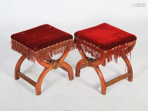 A pair of Victorian Gothic oak X-frame stools, the velvet upholstered rectangular tops with brass