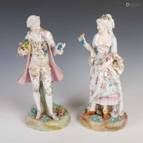 A pair of late 19th century Dresden porcelain figure groups, modelled as female and attendant male