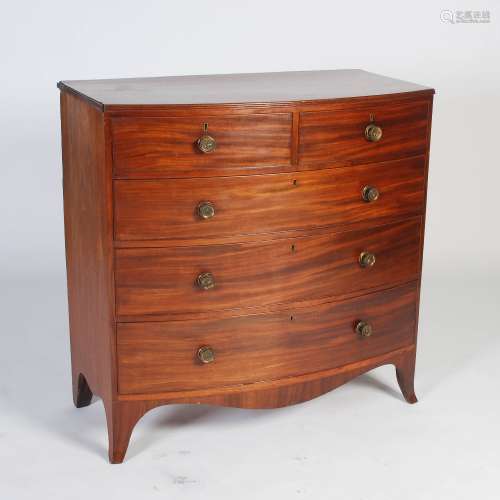 A George III mahogany bow front chest, the shaped top with an applied reeded edge, over two short