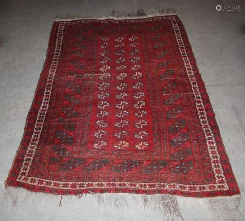 A Tekke rug, late 19th/early 20th century, the rectangular madder ground field decorated with