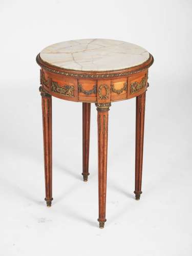A late 19th century French stained beech and gilt metal mounted occasional table, the circular top