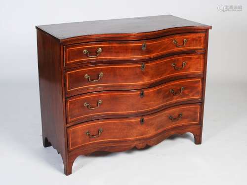 A George III mahogany, boxwood and ebony lined serpentine chest, the shaped rectangular top over