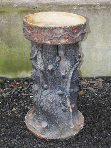 A late 19th century stoneware garden planter, modelled in two sections, the shallow circular bowl