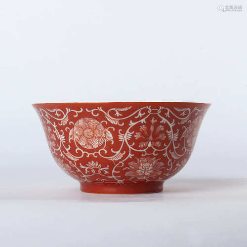 Red glaze bowl with white twigs and flowers