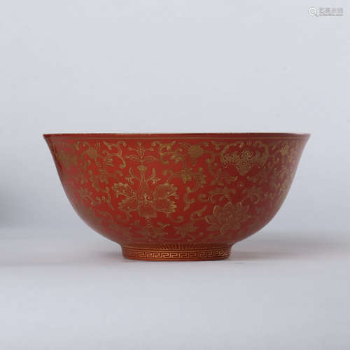 Coral red glaze bowl with gold depiction and flower pattern