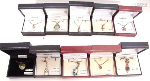 Mixed Lot: ten white metal pendants/necklaces to include turquoise, ruby, and cubic zirconia