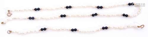 Matching necklace and bracelet of white freshwater cultured pearls interspersed by pairs of black