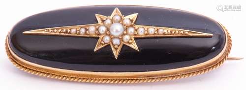 Victorian onyx and pearl brooch of oval form, the slightly curved onyx panel applied with a seed