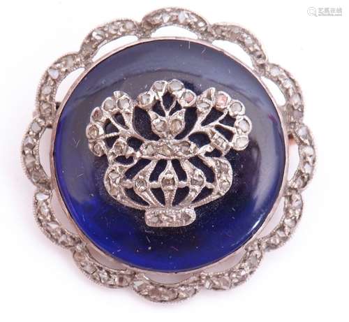 Victorian diamond and blue enamel brooch, the circular blue enamel panel applied with a diamond